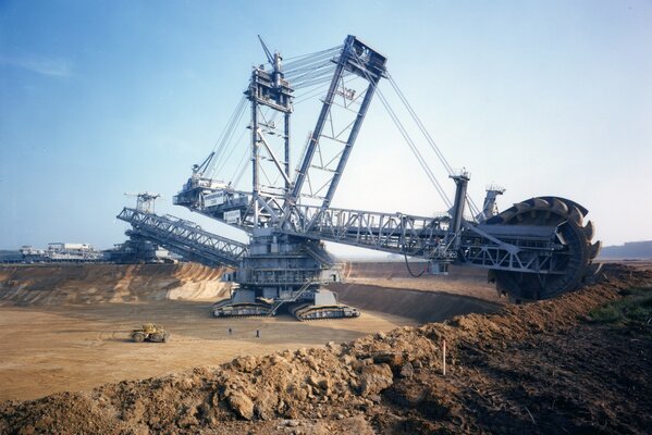 Rotary excavator packer at work