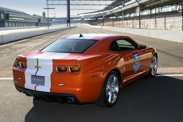 Red and white Chevrolet on the race track