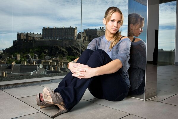 Woman on the background of the city, reflection