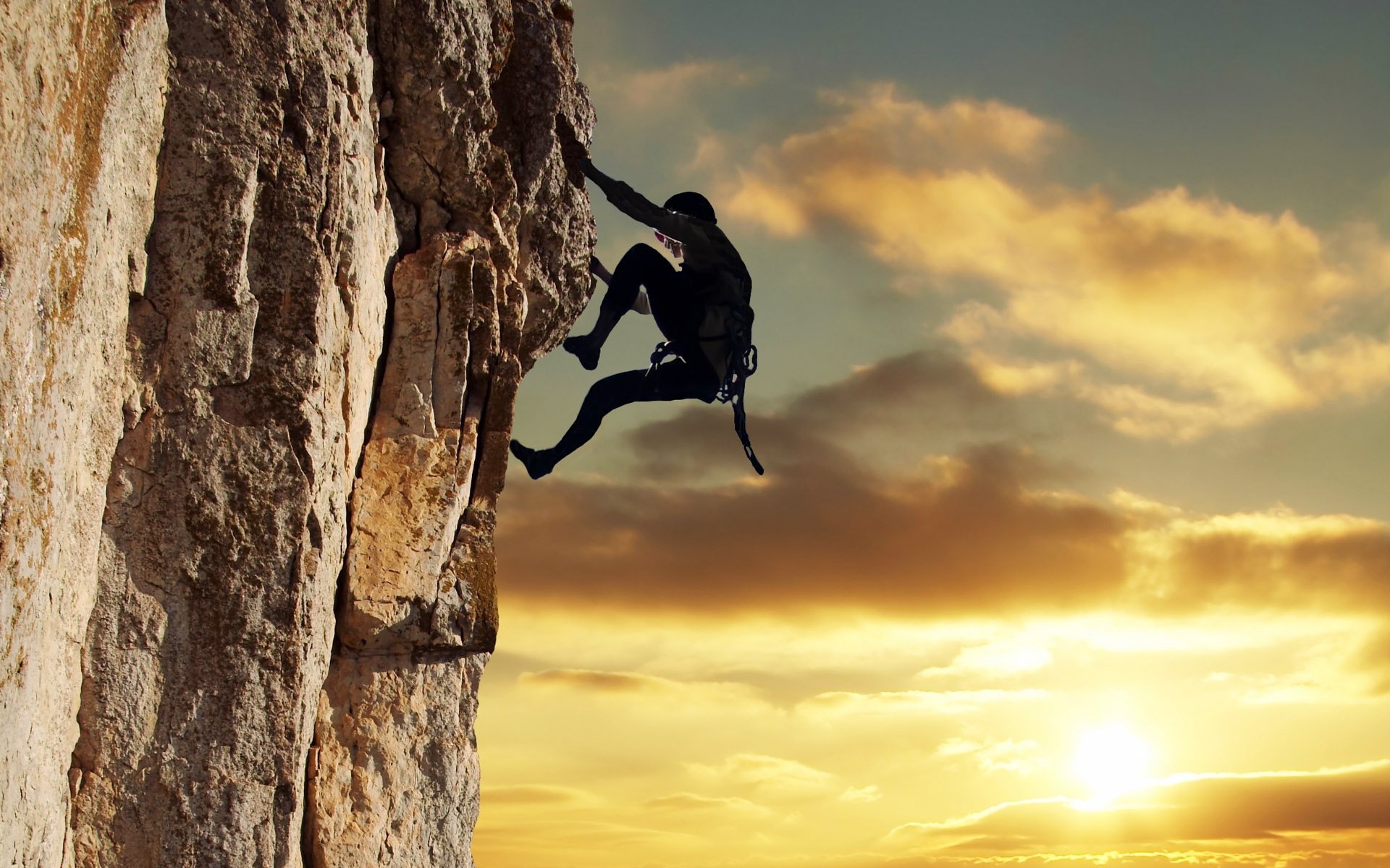 climber black suit cliff cliff sky clouds clouds sun sunset extreme