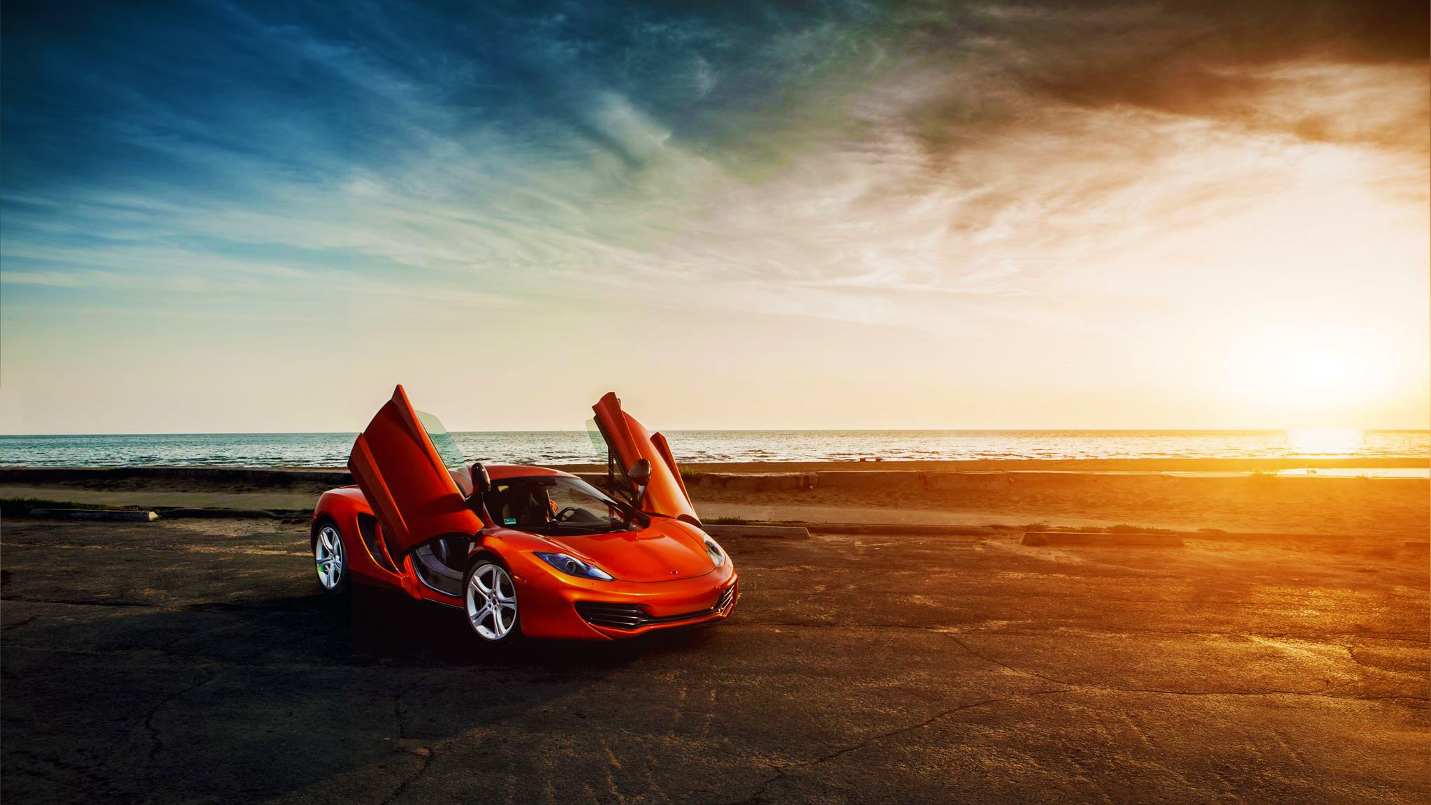 mclaren mp4-12c orange supersportwagen türen meer sonnenuntergang himmel wolke schönheit front