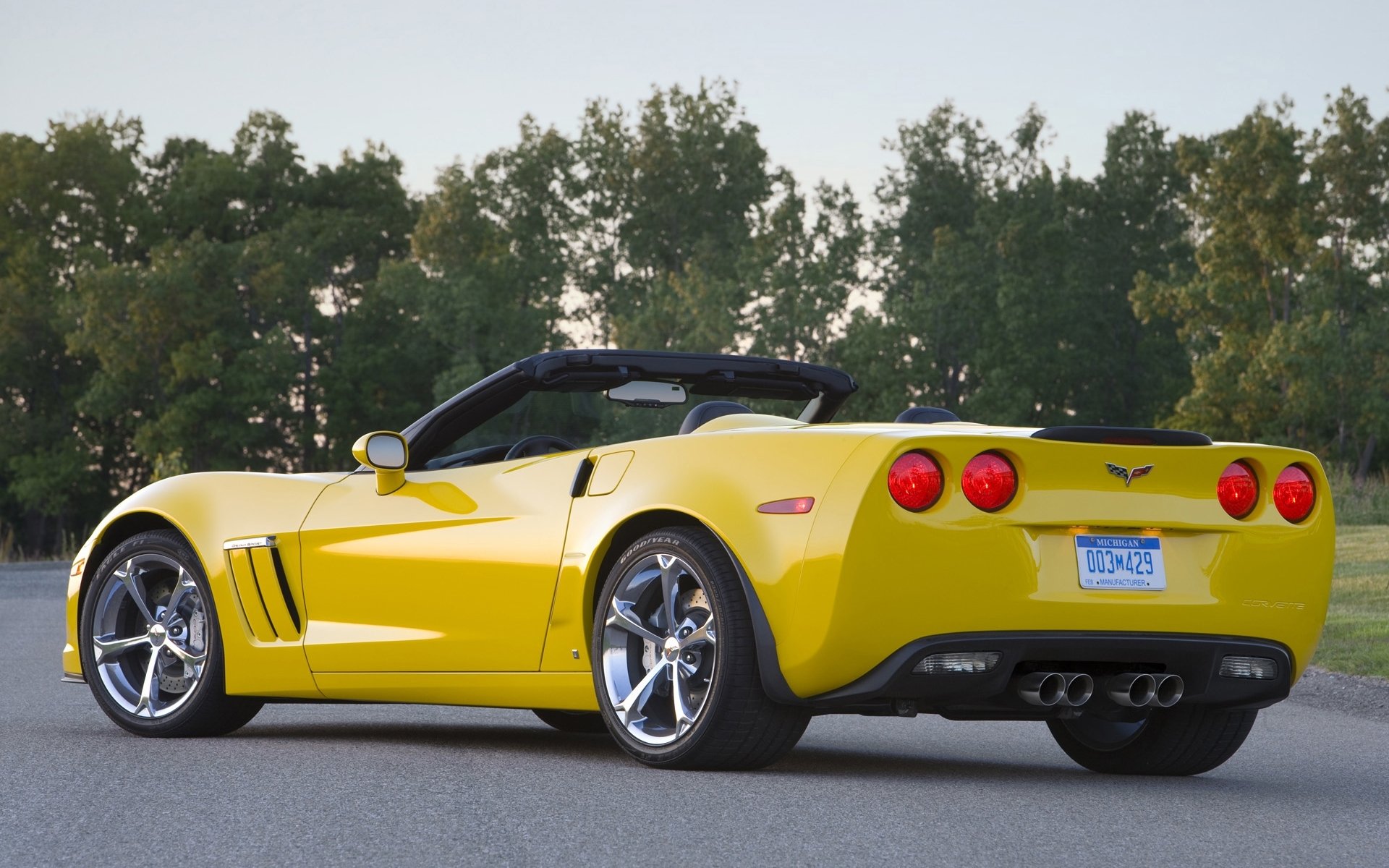 chevrolet corvette grand sport chevrolet convertible supercar yellow rear view road tree