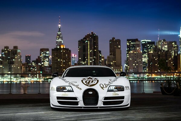 White bugatti veyron on the background of the city