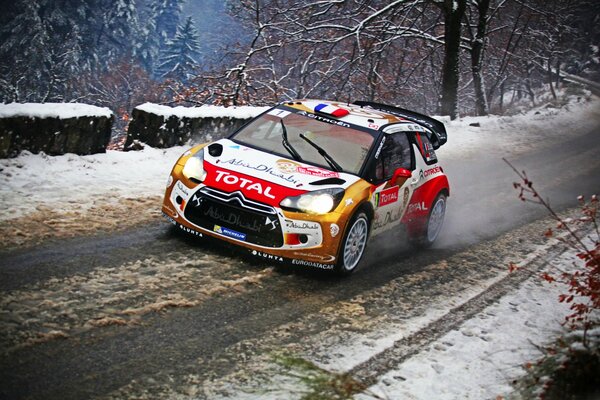 A bright Citroen car on a winter road