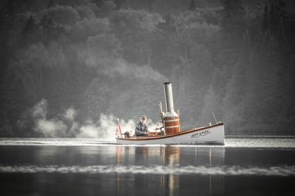 Der alte Mann mit dem Hund ging zum Fluss