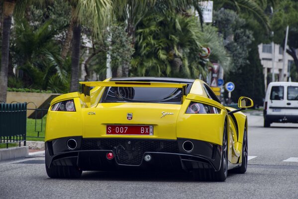 Yellow supercar on city roads