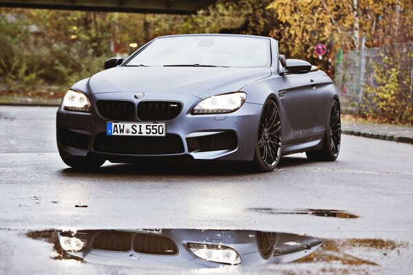 Matte convertible on wet asphalt