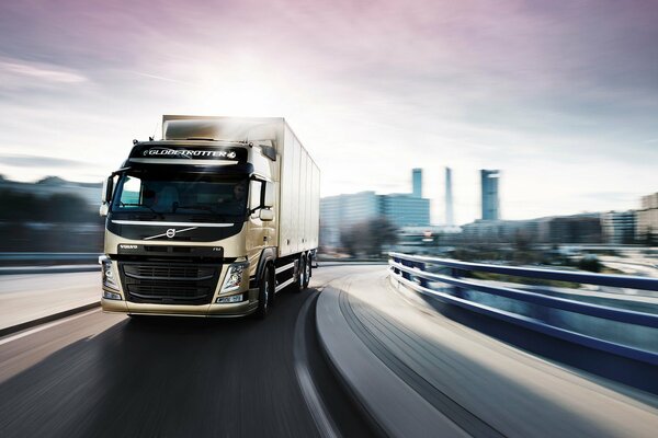 Volvo truck is driving on a city road