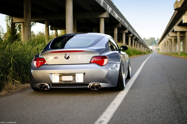 Silver BMW z4. bridge, road