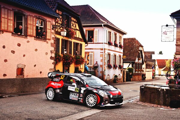 Sports car on the background of a small town 