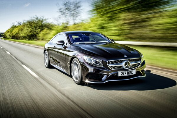 Mercedes-benz s 500 rides on a rural road