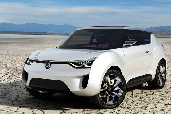 White crossover concept car sang yong against the sky