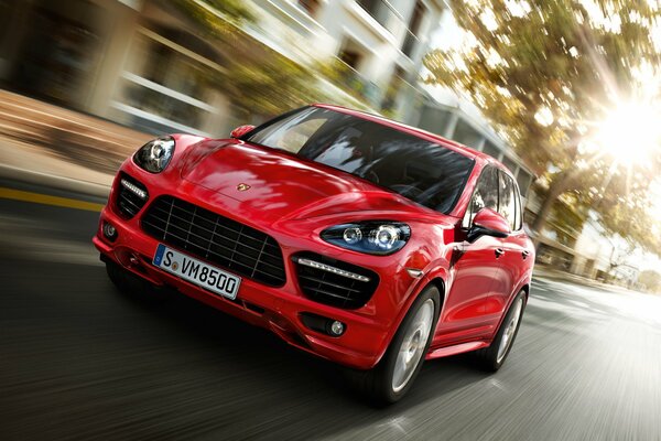 Red Porsche on the road in high-speed mode