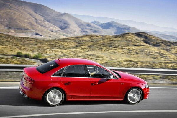 Red Audi on the highway in motion