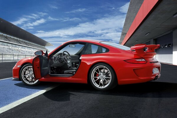 A great combination of blue sky and red car