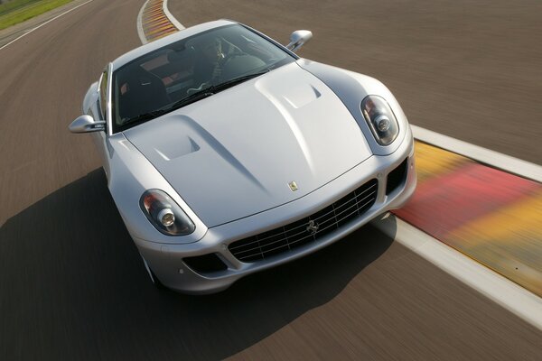 White Ferrari gtb on the track