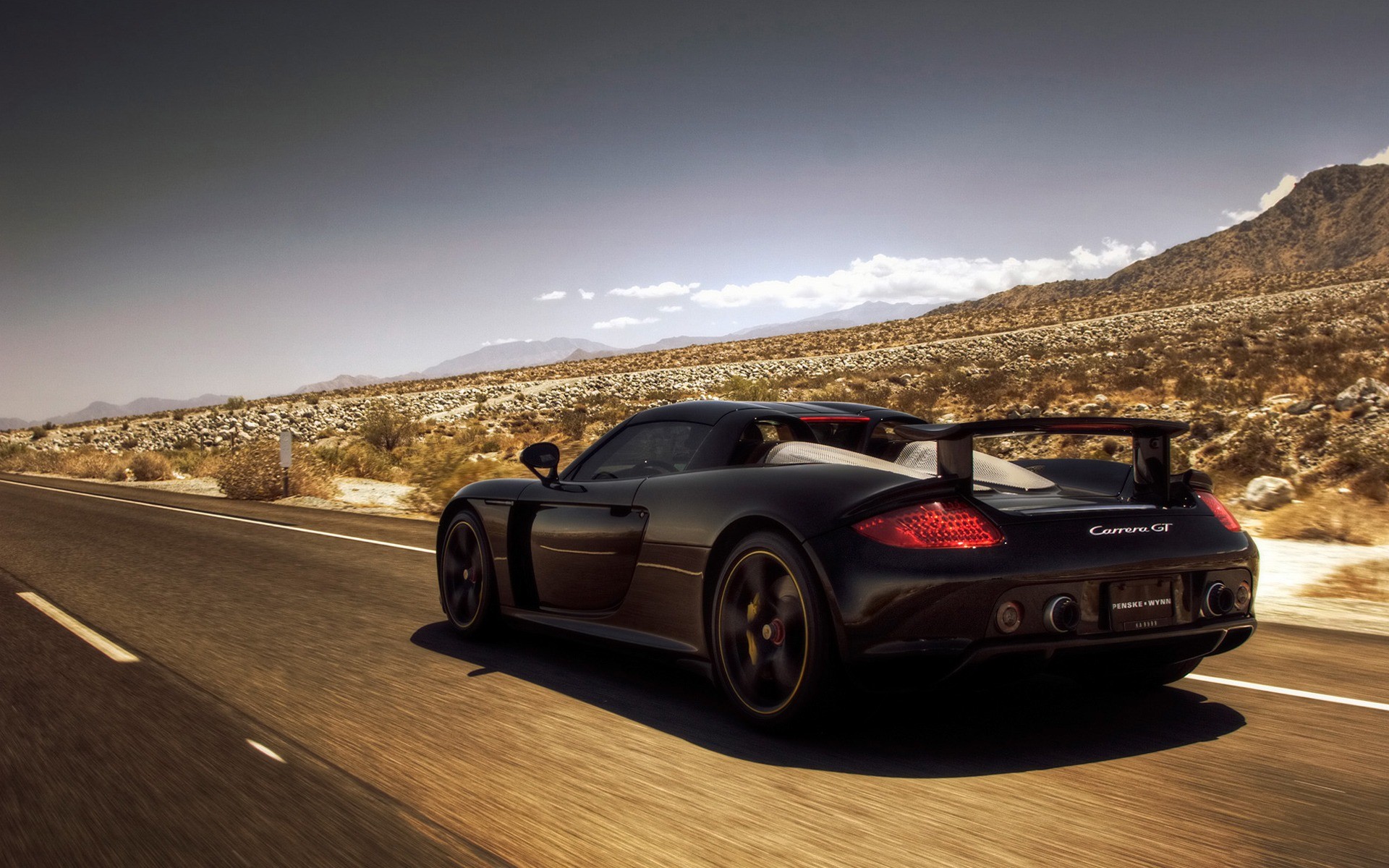 porsche carrera gt porsche deserto strada montagne