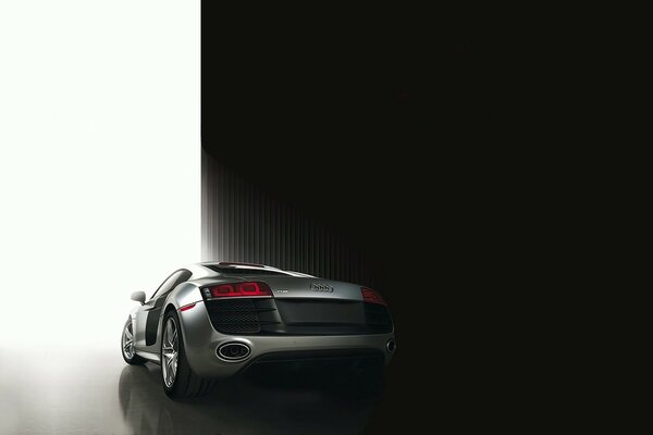 Audi r8 supercar in a stylish photo leaves the garage