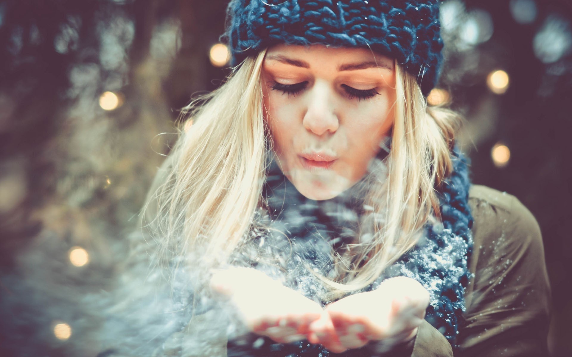 a woman snow girl grey close up blonde