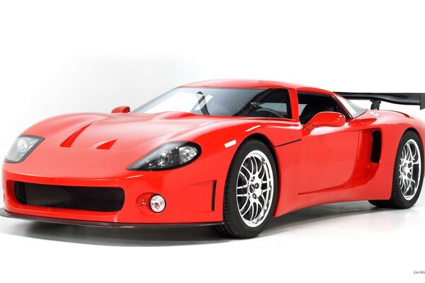 Red sports car on a white background