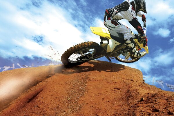 Motorcyclist in the desert on a Suzuki motorcycle