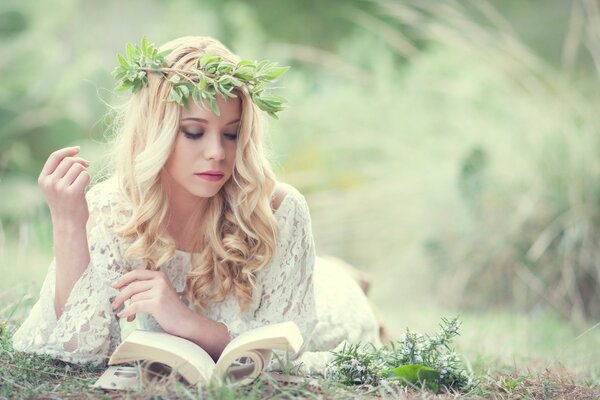 A girl reading a book in nature