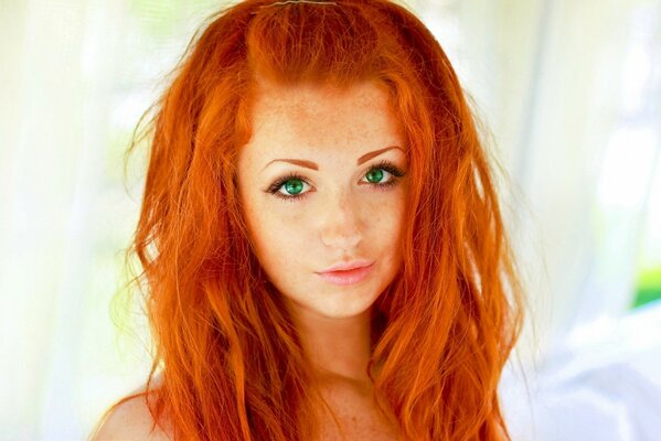 A red-haired beast with green eyes