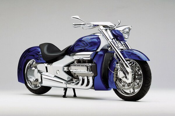 Purple Honda motorcycle with silver bottom