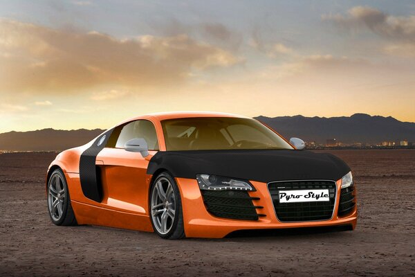 Orange sports car on the sky background