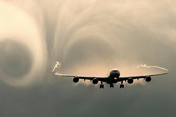 The trail left by the plane in the sky