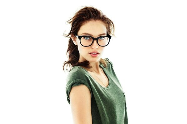 Brunette girl on a white background with glasses