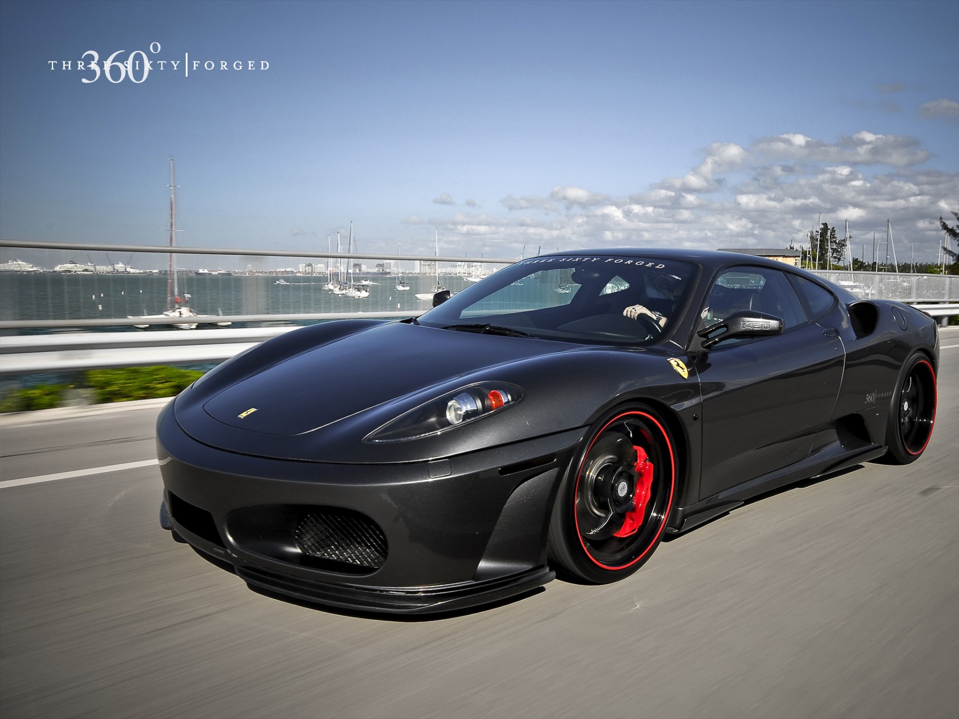 ferrari black red wheels speed bridge