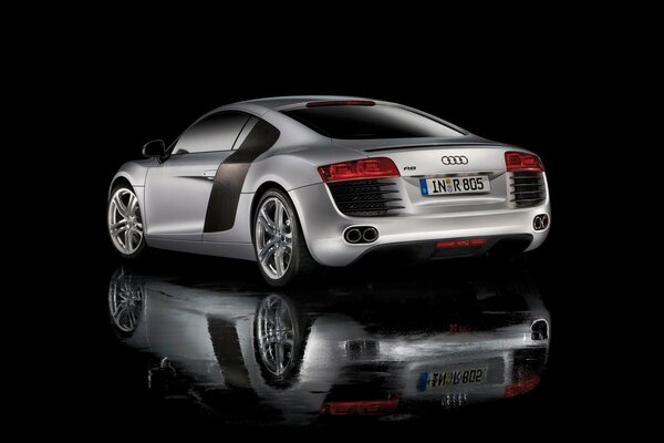 Reflection on the black surface of the audi r8