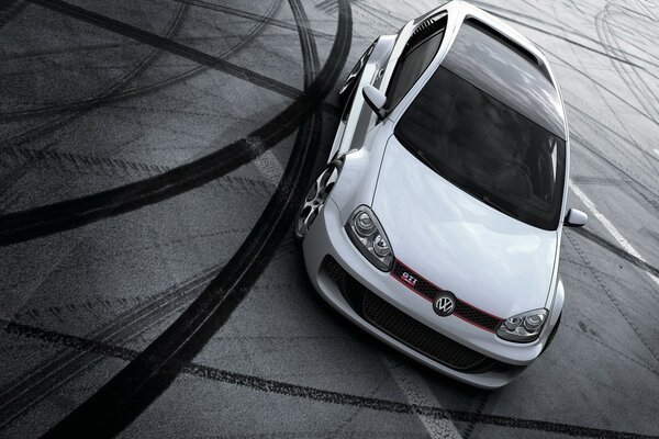 White Volkswagen golf with black roof