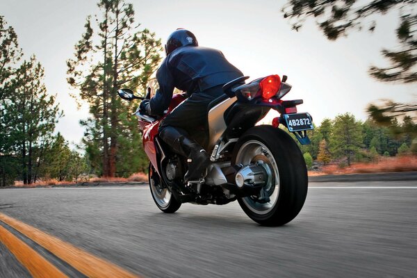 Motorcyclist rides at full speed