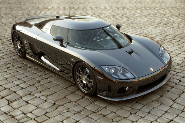 A sports car standing on a paving stone