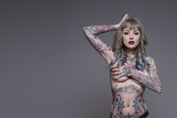 Naked girl in tattoos