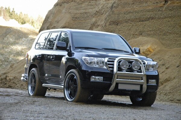 Toyota v8 on the background of the earthen crater