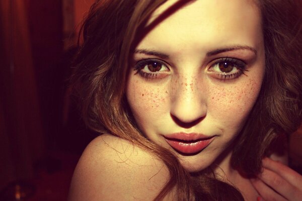 Macro photography of a red-haired girl with brown eyes