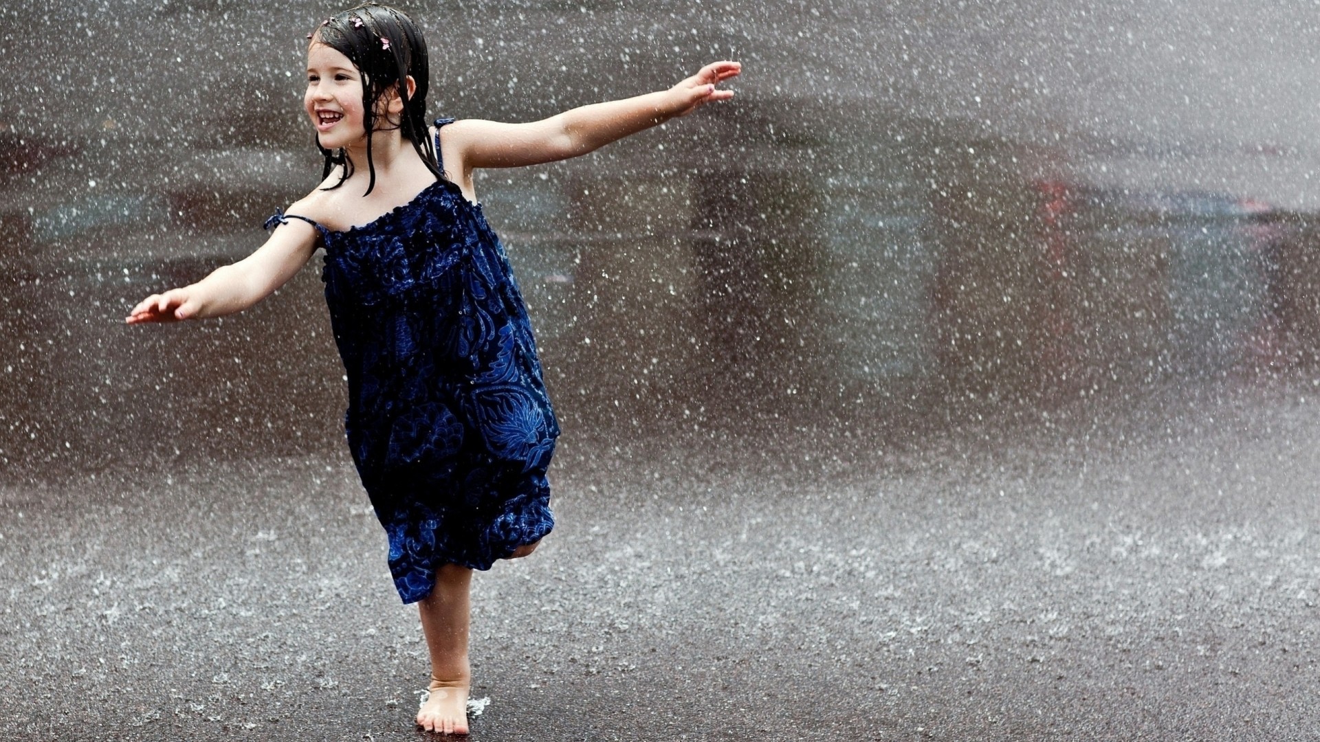 happiness wet girl rain blue dress brunette road falls barefoot child laughter