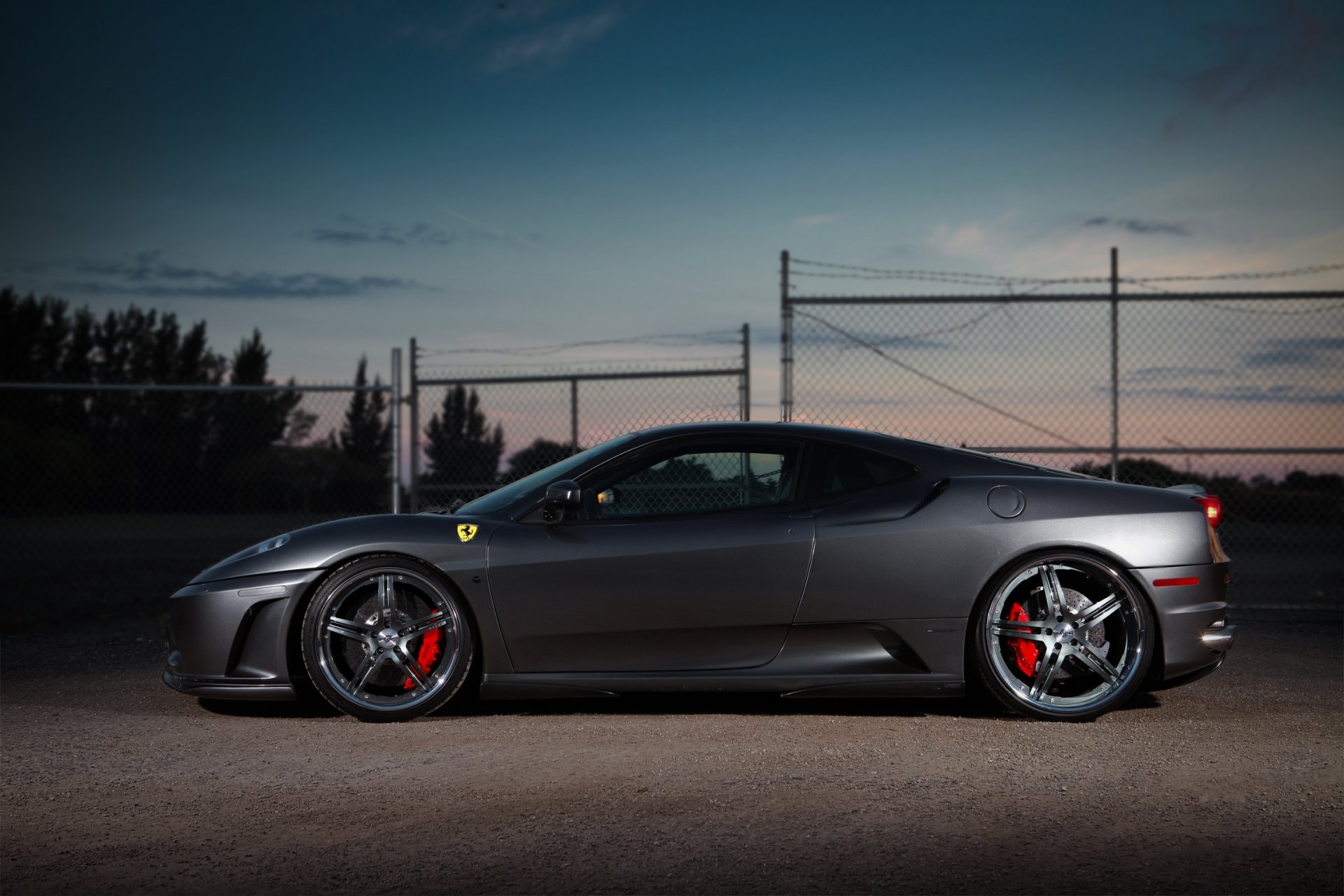 ferrari f430 silver ferrari silver profile wheels evening sky clouds fence