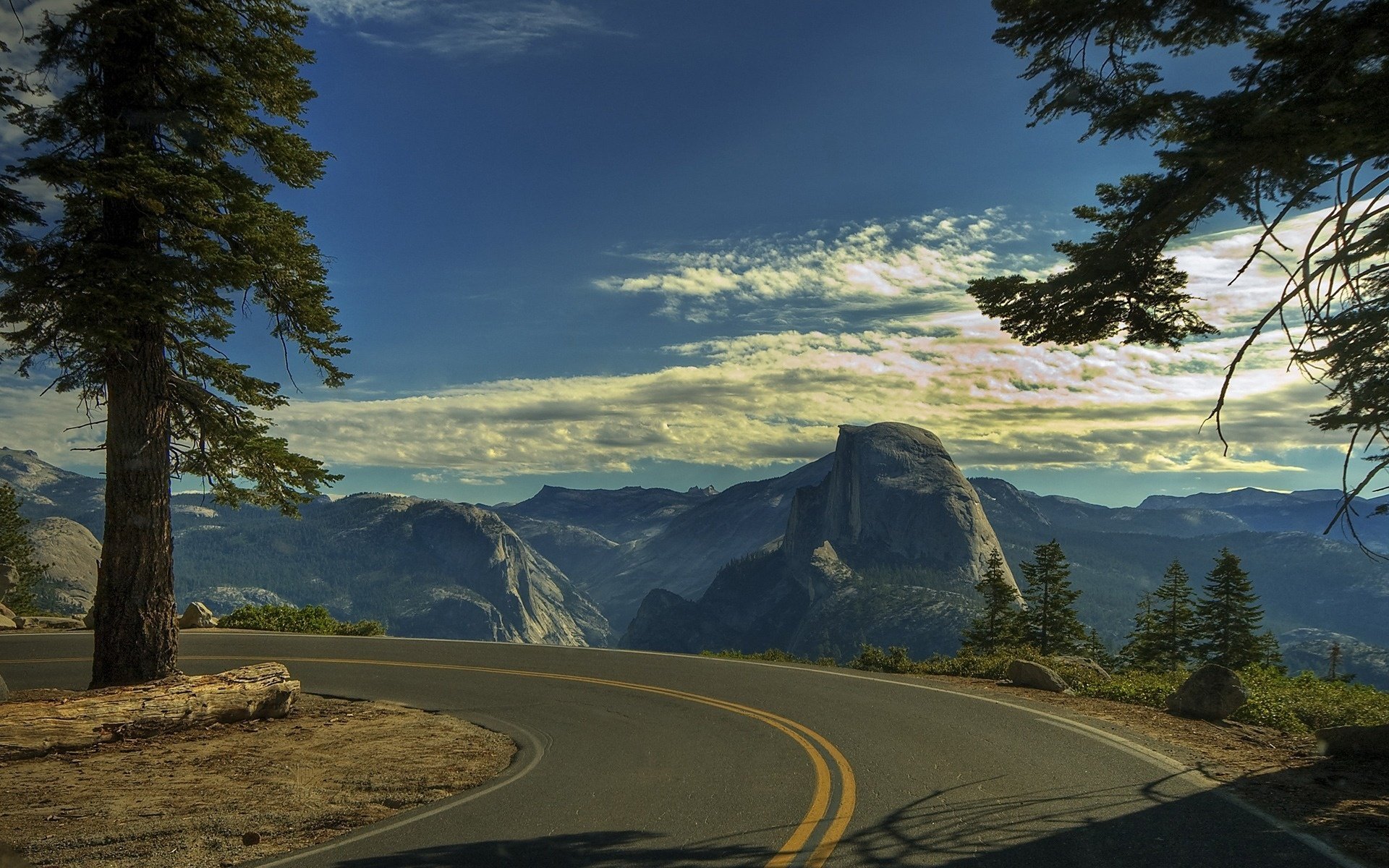 road forest mountains the sky