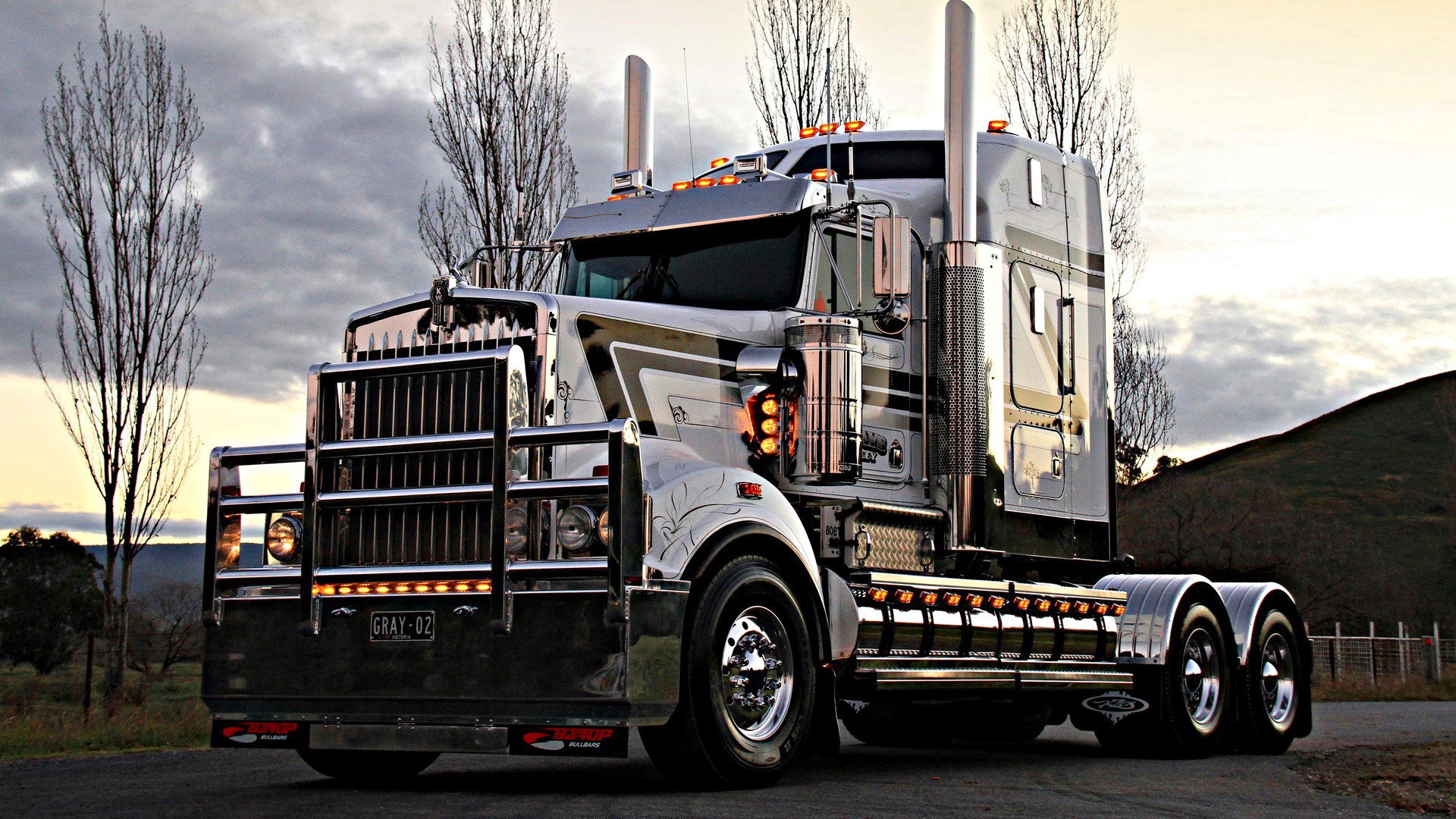 truck tractor nickel pipe sky clouds tree