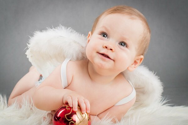 A small child in an angel costume