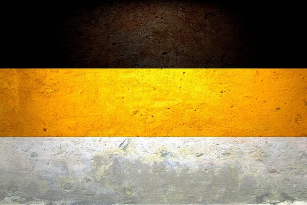 Drapeau De L Empire Russe. Couleur noir-jaune-blanc sur le mur