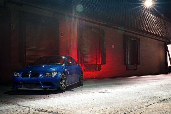 BMW car blue on a background of red background