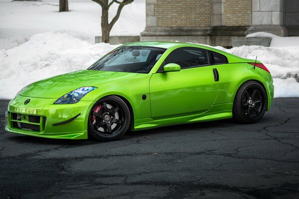 Bright light green sports car on cracked asphalt