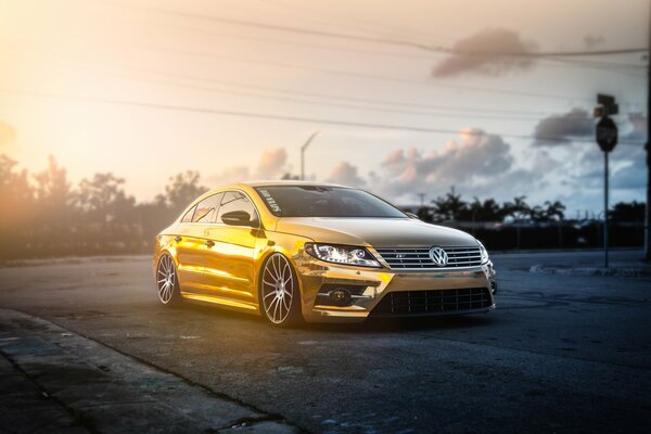 Golden or yellow Volkswagen on the evening highway