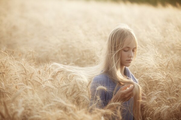 A girl in a beautiful field of mugs