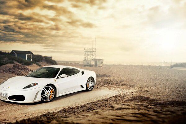 White Ferrari F - 430 on the beach